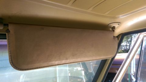 1968 Chevrolet C/K Pickup - Interior view of a vehicle's sun visor and headliner.