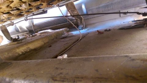 1968 Chevrolet C/K Pickup - The interior floor of a vehicle shows wear and tear, with seat springs visible above.