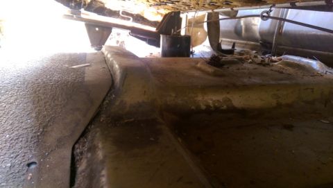 1968 Chevrolet C/K Pickup - Underside view of a vehicle, focusing on the fuel tank and frame.