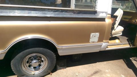 1968 Chevrolet C/K Pickup - Side view of a 1968 Chevrolet C/K Pickup truck, highlighting its body lines and interior details.