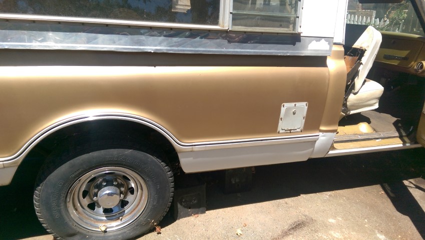 1968 Chevrolet C/K Pickup truck side view showing the rear wheel well, door, and part of the bed