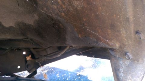 1968 Chevrolet C/K Pickup - The underside of a vehicle shows significant rust and exposed hoses, with a Supermotors.net watermark visible.