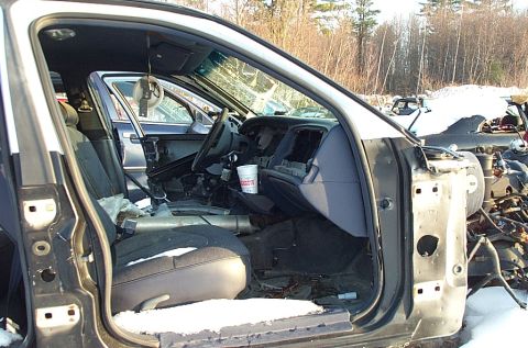 1991 Ford LTD Crown Victoria - Junkyard view of a 1991 Ford Crown Victoria LTD interior, with snow on the ground and other vehicles in the background.