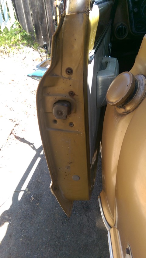 1968 Chevrolet C/K Pickup - Close-up of the door latch mechanism on a gold 1968 Chevrolet C/K Pickup.