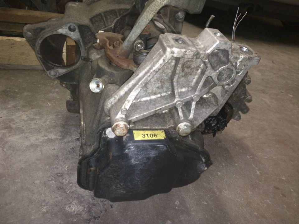 Transmission assembly with yellow sticker showing '3106'