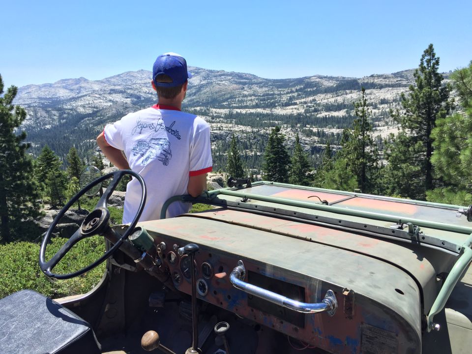 1946 Jeep CJ5 interior with steering wheel and dashboard, overlooking mountains