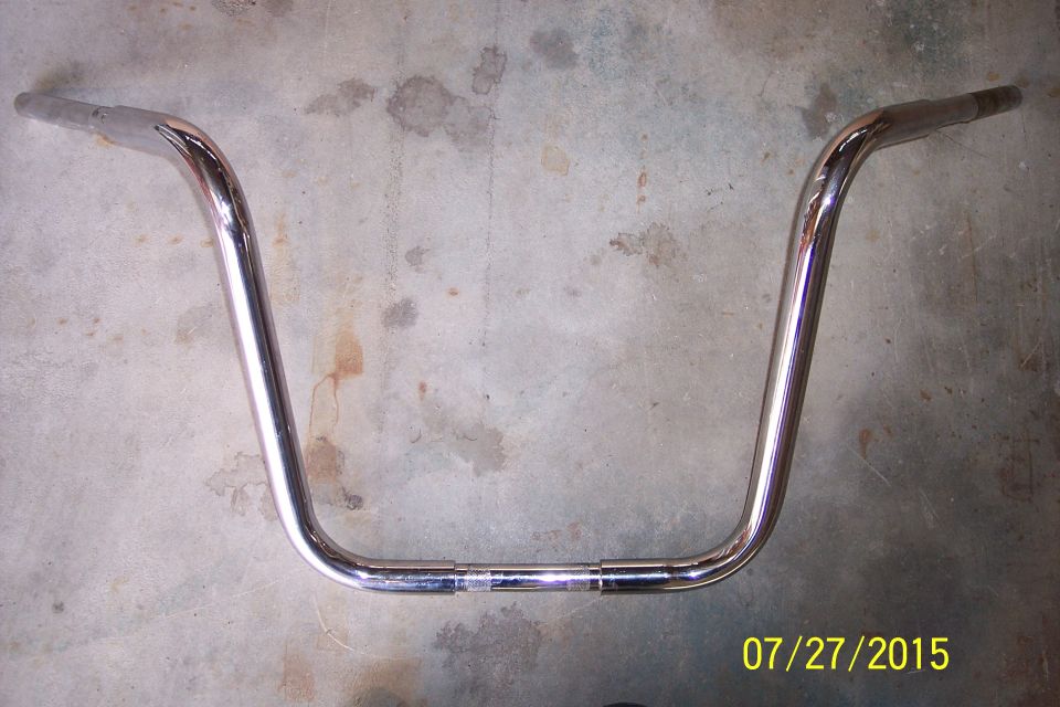 Chrome handlebars on concrete floor