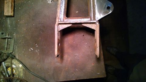 1992 Ford Bronco - Close-up of a fabricated metal bracket, likely for automotive suspension or frame modification.