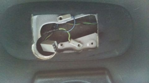 1992 Ford Bronco - Close-up view of the wiring and connector for a vehicle's interior dome light.