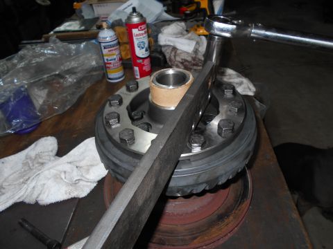 1992 Ford Bronco - A differential carrier is shown with a torque wrench and two cans of spray lubricant.