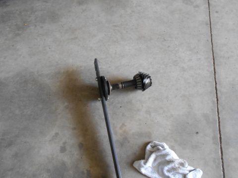 1992 Ford Bronco - Differential gear assembly shown on a concrete surface with a rag nearby.