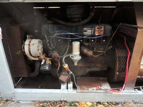 2006 Ford F-250 - Close-up view of a Ford V8 engine, likely from a generator unit, showing various components.
