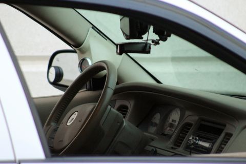 2000 Mercury Grand Marquis - 2000 Mercury Grand Marquis interior, the steering wheel, dashboard, and a radar detector.
