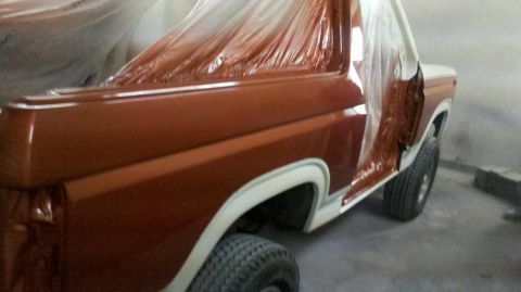 1982 Ford Bronco - This 1982 Ford Bronco is undergoing a paint job, with parts covered in plastic sheeting.