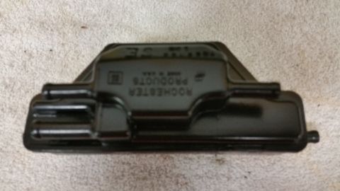 2015 Chevrolet new - A black Rochester Products valve cover is shown, with text embossed on its surface.