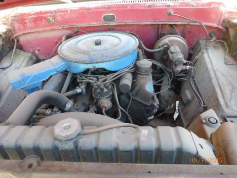 1970 Ford F-250 - Engine bay view of a 1970 Ford F-250, showing the air cleaner and engine components.