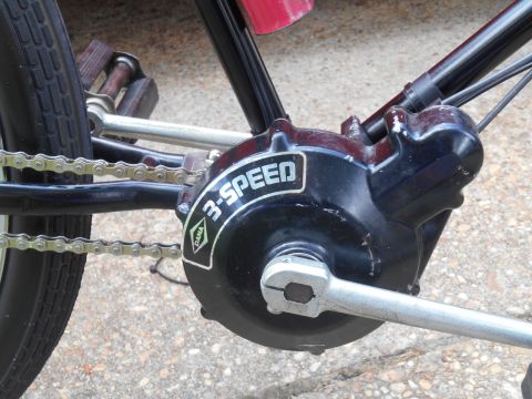Close-up of a bicycle's DANA 3-SPEED internal gear hub and chain.