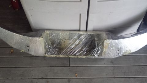 1996 Ford Bronco - I used a combo of wire wheels and Evapo-rust on the bumper to clean up the back side. Here is is all wrapped up and soaking.