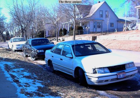 1990 Ford Taurus - The white one in front is now my turbo project, the black one is the one I just painted and the one in the back is my friends 92 sho.