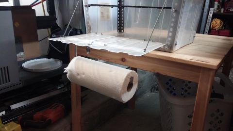1985 Toyota 4Runner - A portable kitchen chuck box setup is shown with a paper towel dispenser attached to the table.