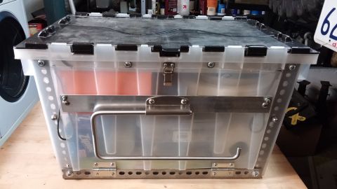 1985 Toyota 4Runner - This clear plastic storage bin has metal reinforcement and a folding handle.