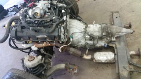 2001 Ford Crown Victoria - Engine and transmission assembly, likely from a Ford Crown Victoria, is shown disassembled.