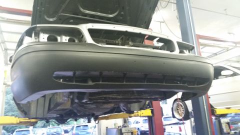 2001 Ford Crown Victoria - Front view of a 2001 Ford Crown Victoria being serviced on a lift.