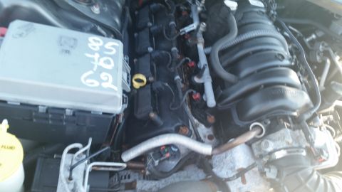 2001 Ford Crown Victoria - Close-up view of an engine bay, a fuse box with handwritten numbers.