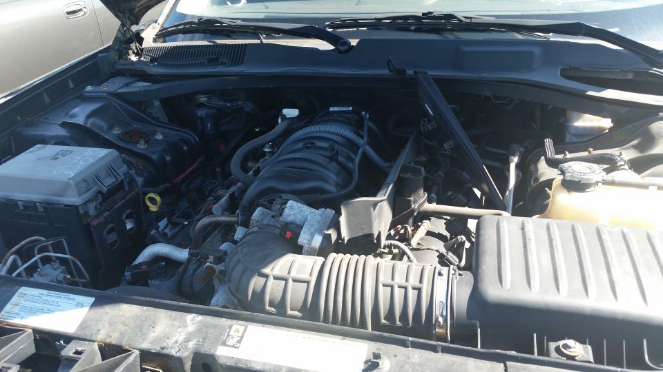 Engine bay of a car with the hood open