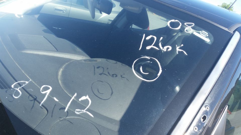 Windshield has chalked markings: '08 126k', '126k', and '8-9-12'