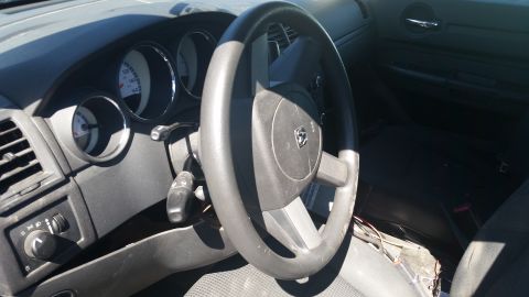 2001 Ford Crown Victoria - Interior view of a car, focusing on the dashboard and steering wheel.