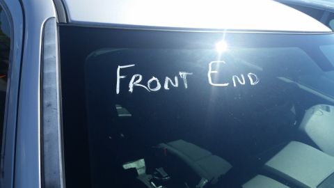 2001 Ford Crown Victoria - Text written on the side window of a car.