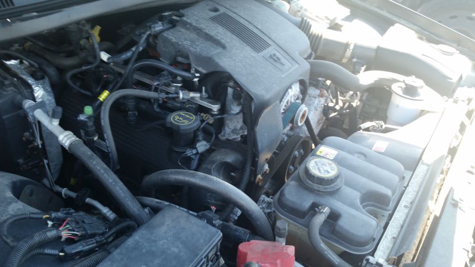 Engine bay with V8 engine components visible