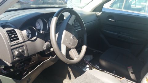 2001 Ford Crown Victoria - Photo of a Dodge car interior with steering wheel and dash, not a technical document.
