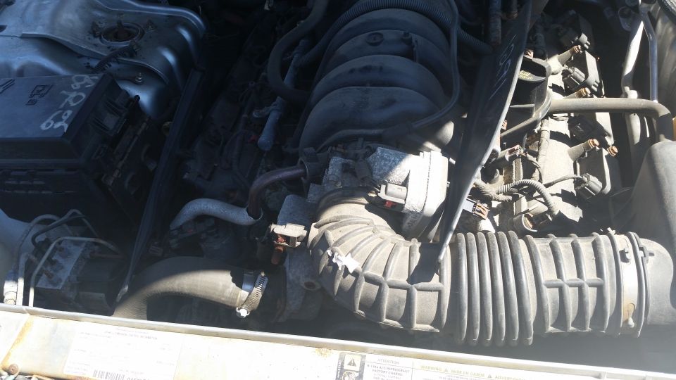Engine bay close-up showing intake manifold and air intake hose