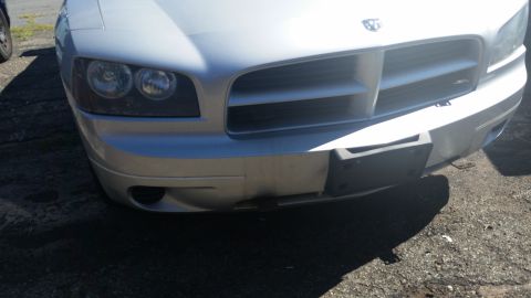 2001 Ford Crown Victoria - Photo of a car front end and bumper, not a technical document.