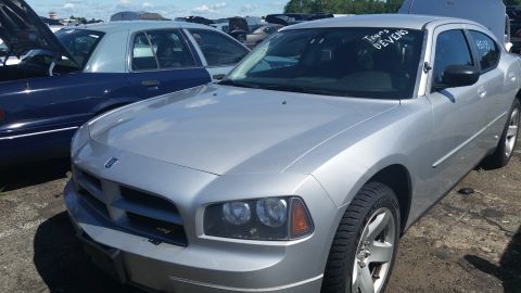 2001 Ford Crown Victoria - Photo of a Dodge Charger in a lot, not a technical document.