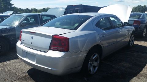 2001 Ford Crown Victoria - Photo of a Dodge Charger in a salvage lot, not a technical document.