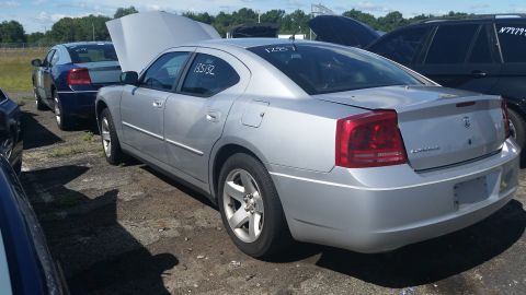2001 Ford Crown Victoria - Photo of a Dodge Charger in a lot, not a technical document.