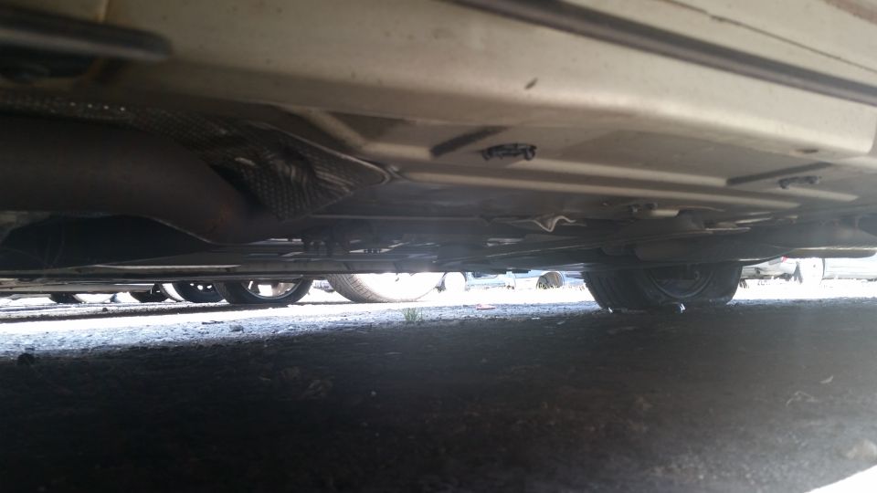 Underside view of a vehicle exhaust system and chassis