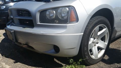 2001 Ford Crown Victoria - Photo of a car front corner and wheel, not a technical document.