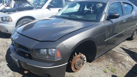 2001 Ford Crown Victoria - Photo of a Dodge Charger in a salvage lot, not a technical document.