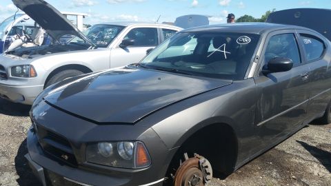 2001 Ford Crown Victoria - Photo of a Dodge Charger in a salvage lot, not a technical document.