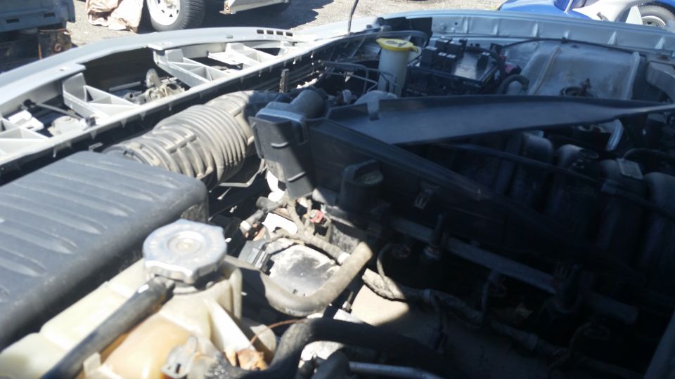 Engine bay photo with air intake and reservoirs