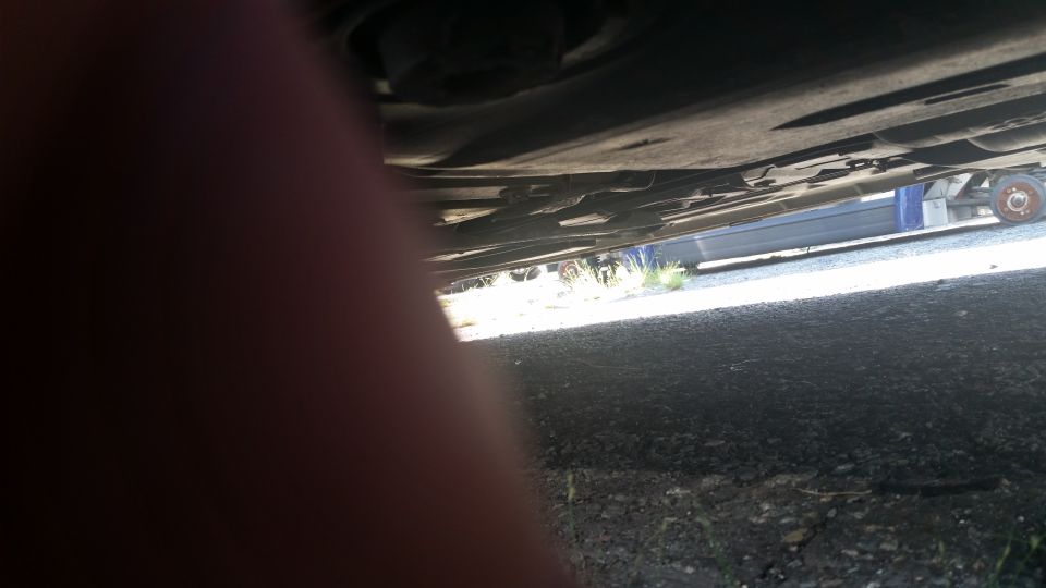 Photo looking under a vehicle undercarriage