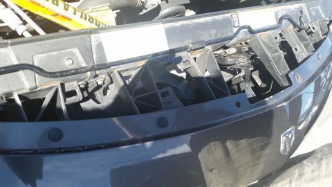 2001 Ford Crown Victoria - Photo of a vehicle front bumper cover interior with mounting brackets and structure.