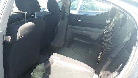 2001 Ford Crown Victoria - Photo of the rear bench seat and door panels inside a Dodge Charger.