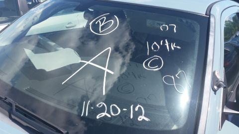 2001 Ford Crown Victoria - Photo of a vehicle windshield marked in white grease pencil with B, A, 07, and date 11-20-12.