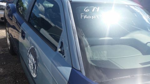 2001 Ford Crown Victoria - Photo of a vehicle window marked in white grease pencil reading 674 and front.