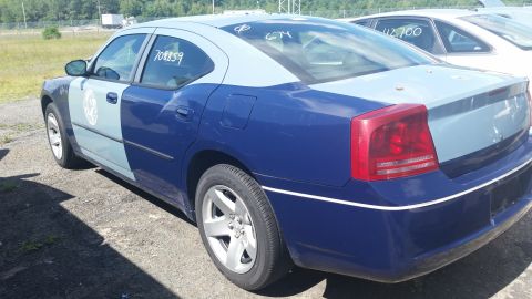 2001 Ford Crown Victoria - Photo of the rear quarter of a two-tone blue Dodge Charger with grease-pencil markings.